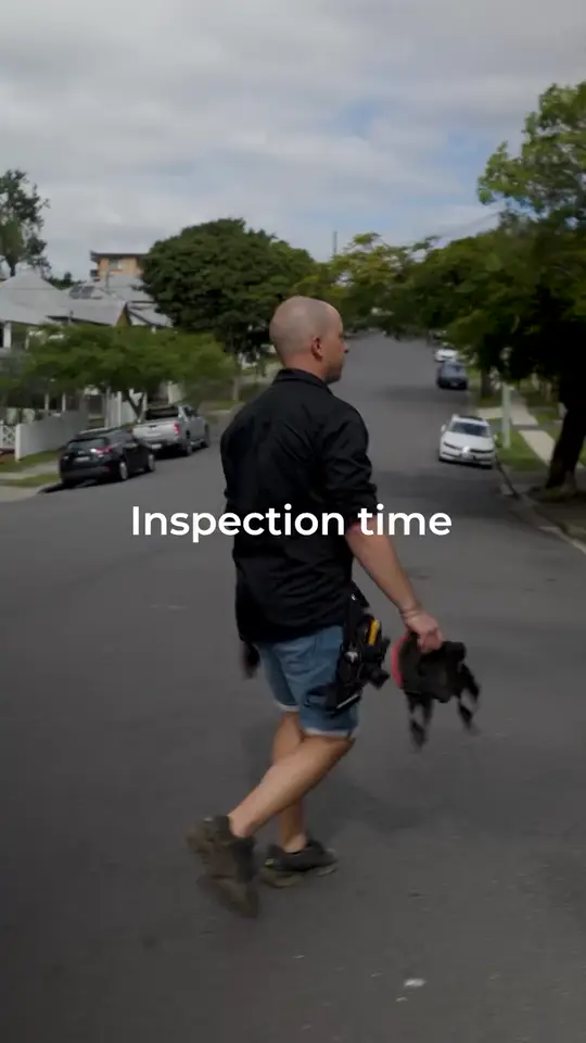 An InspectorPro inspector walking up a suburban street, captioned inspection time.